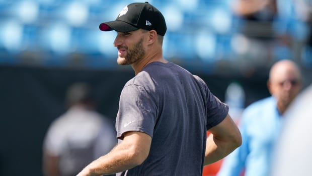 Kirk Cousins looks over his shoulder smiling